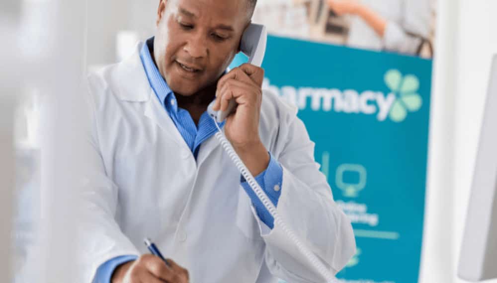 Pharmacist on phone with patient