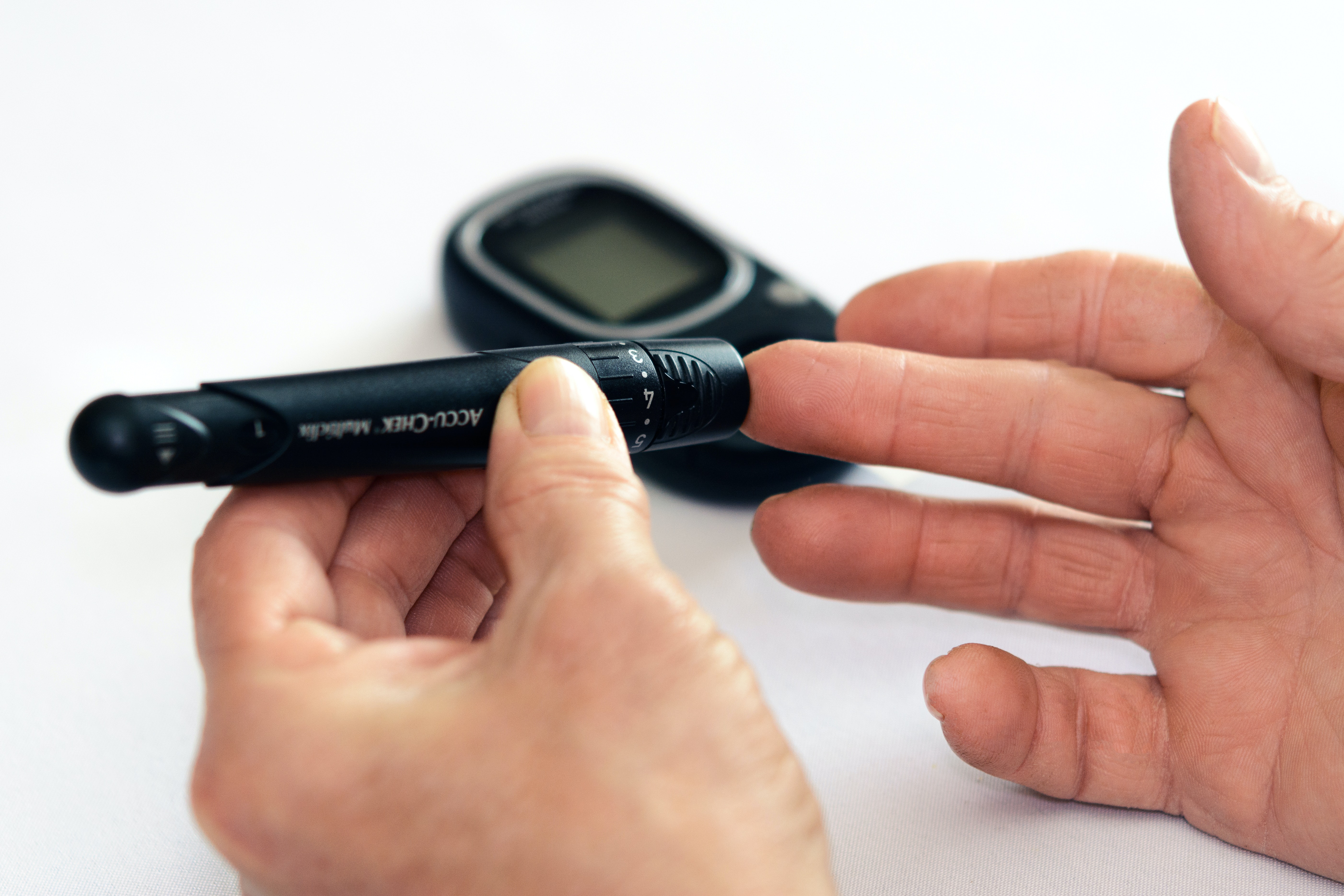 An individual with hypoglycemia checking their blood sugar levels.
